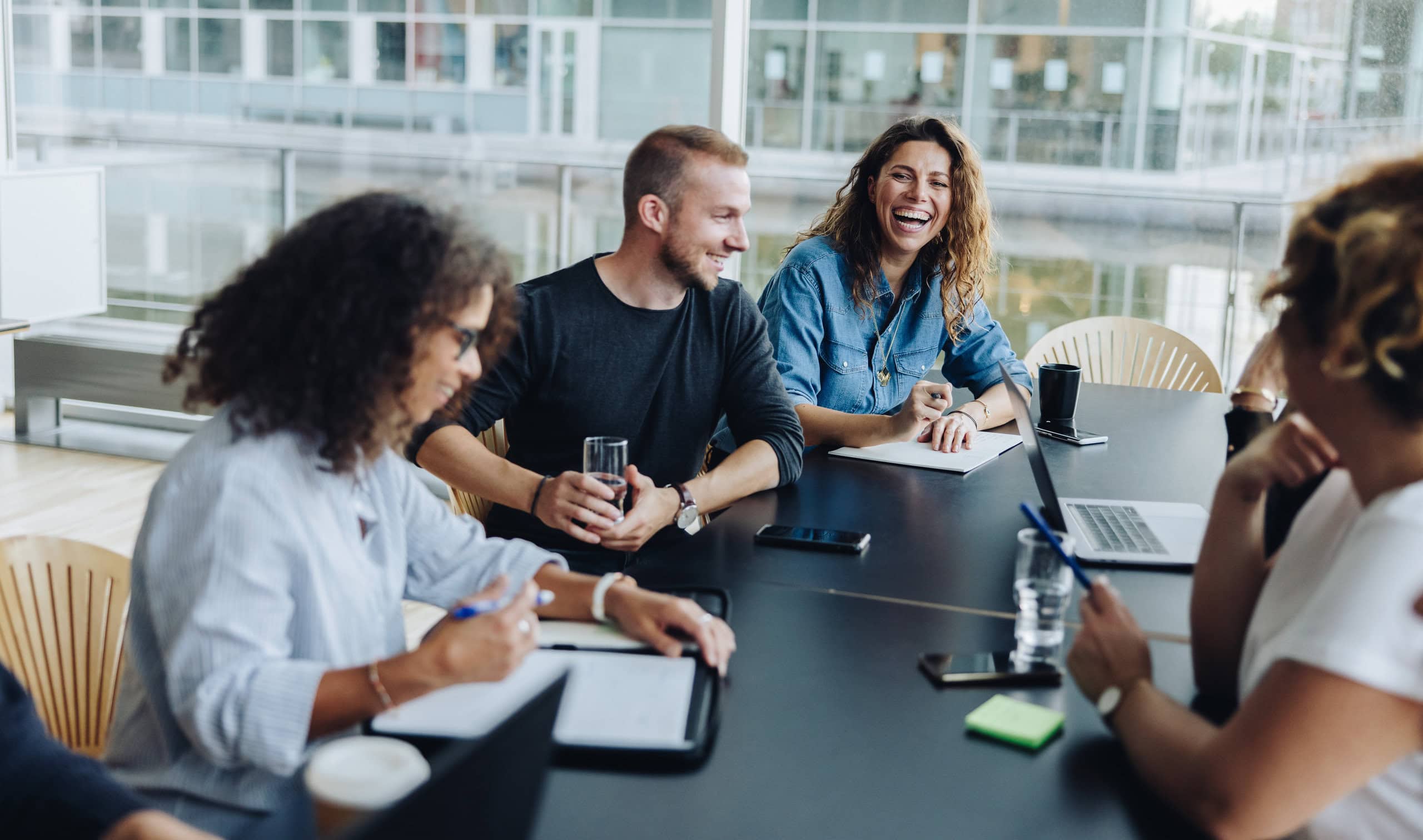 People smiling in a meeting